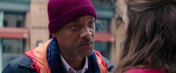 Movie still from “Collateral Beauty” (2016), directed by David Frankel – A person wearing a hat; Close Up shot, Over the shoulder angle