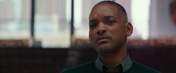 Movie still from “Collateral Beauty” (2016), directed by David Frankel – A person wearing a green shirt; Close Up shot, Over the shoulder angle