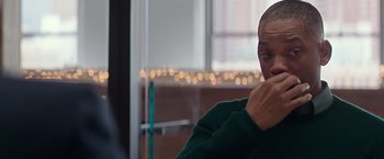 Movie still from “Collateral Beauty” (2016), directed by David Frankel – A man sitting in front of a window eating something; Close Up shot, Over the shoulder angle