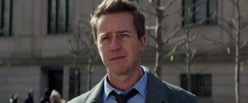 Movie still from “Collateral Beauty” (2016), directed by David Frankel – A person wearing a suit and tie; Close Up shot, Over the shoulder angle