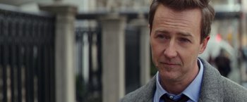 Movie still from “Collateral Beauty” (2016), directed by David Frankel – A person wearing a suit and tie; Close Up shot, Over the shoulder angle
