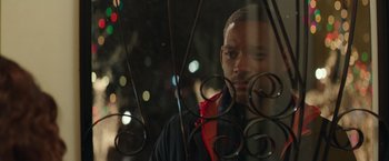 Movie still from “Collateral Beauty” (2016), directed by David Frankel – A person looking through a window; Close Up shot, Over the shoulder angle