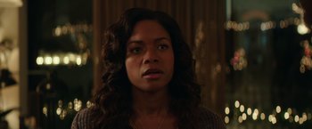 Movie still from “Collateral Beauty” (2016), directed by David Frankel – A woman that is staring at the camera; Close Up shot, Over the shoulder angle