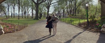 Movie still from “Collateral Beauty” (2016), directed by David Frankel – A man and a woman walking down a road; Wide shot, High angle
