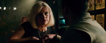 Movie still from “Collide” (2016), directed by Eran Creevy – A woman with blonde hair is talking to a man; Close Up shot, Over the shoulder angle
