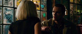 Movie still from “Collide” (2016), directed by Eran Creevy – A man and a woman are sitting at a table; Close Up shot, Over the shoulder angle