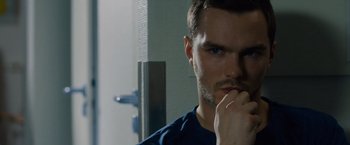 Movie still from “Collide” (2016), directed by Eran Creevy – A person with his hand on his chin; Close Up shot, Over the shoulder angle