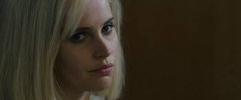 Movie still from “Collide” (2016), directed by Eran Creevy – A person with blonde hair; Close Up shot, Over the shoulder angle
