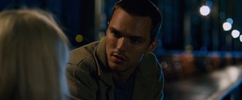 Movie still from “Collide” (2016), directed by Eran Creevy – A person wearing a jacket; Close Up shot, Over the shoulder angle