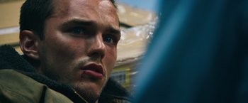 Movie still from “Collide” (2016), directed by Eran Creevy – A man's face in a car window; Close Up shot, Low angle