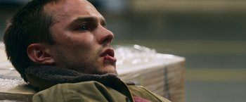 Movie still from “Collide” (2016), directed by Eran Creevy – A person with his mouth wide open; Close Up shot, Low angle