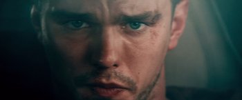Movie still from “Collide” (2016), directed by Eran Creevy – A man's face with blue eyes; Extreme Close Up shot, Low angle