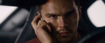 Movie still from “Collide” (2016), directed by Eran Creevy – A person talking on a cell phone; Close Up shot, Over the shoulder angle
