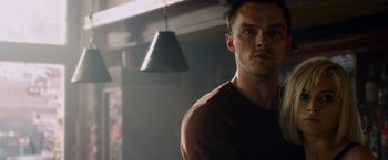 Movie still from “Collide” (2016), directed by Eran Creevy – A person wearing a brown shirt; Close Up shot, Low angle