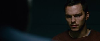 Movie still from “Collide” (2016), directed by Eran Creevy – A person in a dark room; Close Up shot, Over the shoulder angle