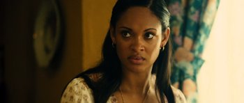 Movie still from “Colombiana” (2011), directed by Olivier Megaton – A person with long black hair; Close Up shot, Over the shoulder angle