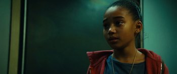 Movie still from “Colombiana” (2011), directed by Olivier Megaton – A young girl is looking into the distance; Close Up shot, High angle
