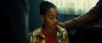 Movie still from “Colombiana” (2011), directed by Olivier Megaton – A young girl sitting in front of a window; Close Up shot, Over the shoulder angle