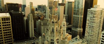 Movie still from “Colombiana” (2011), directed by Olivier Megaton – An aerial view of a large city with a clock tower; Extreme Wide shot, High angle