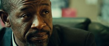 Movie still from “Colombiana” (2011), directed by Olivier Megaton – A man's eyes and face; Close Up shot, Low angle