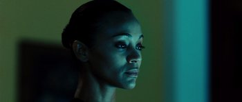 Movie still from “Colombiana” (2011), directed by Olivier Megaton – A woman's face in the dark; Close Up shot, Low angle