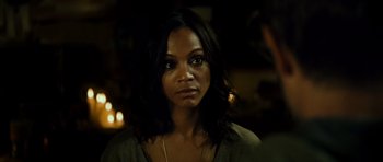 Movie still from “Colombiana” (2011), directed by Olivier Megaton – A person wearing a necklace; Close Up shot, Over the shoulder angle