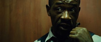 Movie still from “Colombiana” (2011), directed by Olivier Megaton – A person wearing a shirt and tie; Close Up shot, Low angle