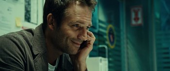 Movie still from “Colombiana” (2011), directed by Olivier Megaton – A person talking on a cell phone; Close Up shot, Over the shoulder angle