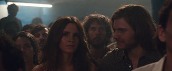 Movie still from “Colonia” (2015), directed by Florian Gallenberger – A group of people standing next to each other in a room; Close Up shot, Over the shoulder angle
