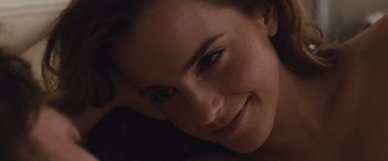 Movie still from “Colonia” (2015), directed by Florian Gallenberger – A woman's face as she smiles for the camera; Close Up shot, Overhead angle