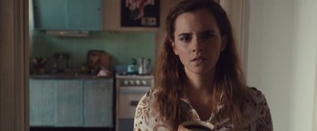 Movie still from “Colonia” (2015), directed by Florian Gallenberger – A young woman holding a coffee mug in a kitchen; Close Up shot, Over the shoulder angle