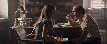 Movie still from “Colonia” (2015), directed by Florian Gallenberger – A man and a woman sitting at a table; Medium shot, Over the shoulder angle