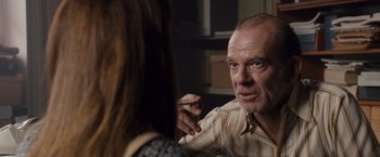 Movie still from “Colonia” (2015), directed by Florian Gallenberger – A man and a woman are talking to each other; Close Up shot, Over the shoulder angle