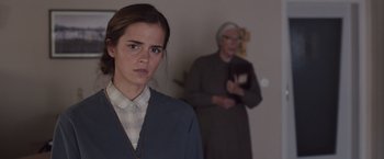Movie still from “Colonia” (2015), directed by Florian Gallenberger – A woman standing in front of an older woman; Close Up shot, Over the shoulder angle