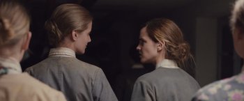 Movie still from “Colonia” (2015), directed by Florian Gallenberger – A couple of women standing next to each other; Close Up shot, Low angle