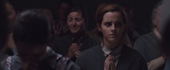 Movie still from “Colonia” (2015), directed by Florian Gallenberger – A group of people that are standing in a room; Close Up shot, Over the shoulder angle