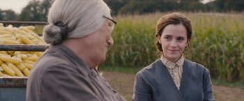 Movie still from “Colonia” (2015), directed by Florian Gallenberger – A woman and an old woman talking to each other outside; Close Up shot, Over the shoulder angle