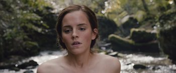 Movie still from “Colonia” (2015), directed by Florian Gallenberger – A woman with a bare chest is looking into the distance; Close Up shot, Low angle