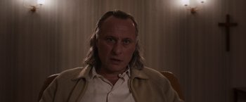 Movie still from “Colonia” (2015), directed by Florian Gallenberger – A person with long hair; Close Up shot, Low angle