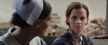 Movie still from “Colonia” (2015), directed by Florian Gallenberger – Two women sitting next to each other on a bench; Close Up shot, Over the shoulder angle