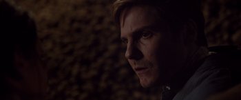 Movie still from “Colonia” (2015), directed by Florian Gallenberger – A person looking at the camera; Close Up shot, Over the shoulder angle
