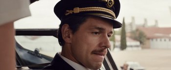 Movie still from “Colonia” (2015), directed by Florian Gallenberger – A person wearing a hat; Close Up shot, Low angle