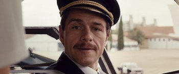 Movie still from “Colonia” (2015), directed by Florian Gallenberger – A person wearing a hat; Close Up shot, Low angle