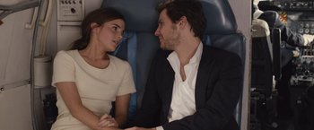 Movie still from “Colonia” (2015), directed by Florian Gallenberger – A man and a woman sitting in the back of a car; Close Up shot, Over the shoulder angle