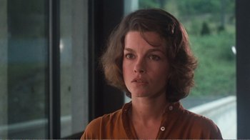 Movie still from “Coma” (1978), directed by Michael Crichton – A person with short brown hair; Close Up shot, Over the shoulder angle