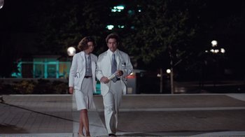 Movie still from “Coma” (1978), directed by Michael Crichton – A man and a woman walking on a sidewalk at night; Wide shot, Low angle