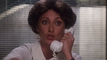 Movie still from “Coma” (1978), directed by Michael Crichton – A woman holding a phone up to her ear; Close Up shot, Low angle