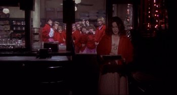 Movie still from “Come Back to the 5 & Dime Jimmy Dean, Jimmy Dean” (1982), directed by Robert Altman – A group of people in a room looking in a mirror; Medium shot, Over the shoulder angle