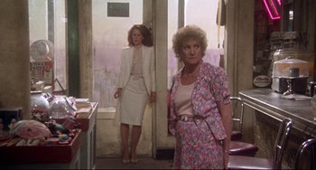 Movie still from “Come Back to the 5 & Dime Jimmy Dean, Jimmy Dean” (1982), directed by Robert Altman – Two women standing next to each other in front of a window; Medium shot, Over the shoulder angle