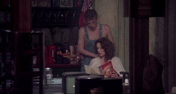 Movie still from “Come Back to the 5 & Dime Jimmy Dean, Jimmy Dean” (1982), directed by Robert Altman – A man and a woman reading a magazine; Medium shot, Over the shoulder angle